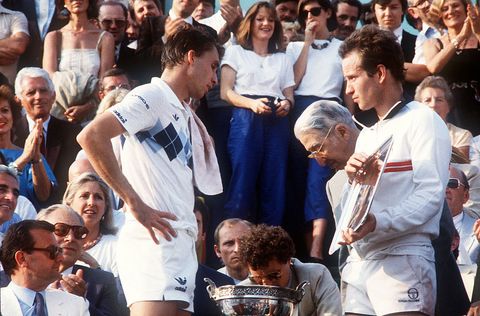 paris, france   june 10  american tennis player john mcenroe r holds the silver plate as czekoslovakian player ivan lendl waits to receive the cup for his victory against top seeded mcenroe in the mens final of the french tennis open in roland garros in paris 10 june 1984 ivan lendl won 3 6, 2 6, 6 4, 7 5, 7 5  film  photo credit should read fageafp via getty images