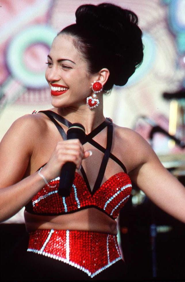 hollywood, ca march 23: actress jennifer lopez, who plays selena in the movie selena, performs in one of the scenes from the movie. selena is about the tejano singer who is murdered by her fan club president. (photo credit should read scott del amo/afp via getty images)