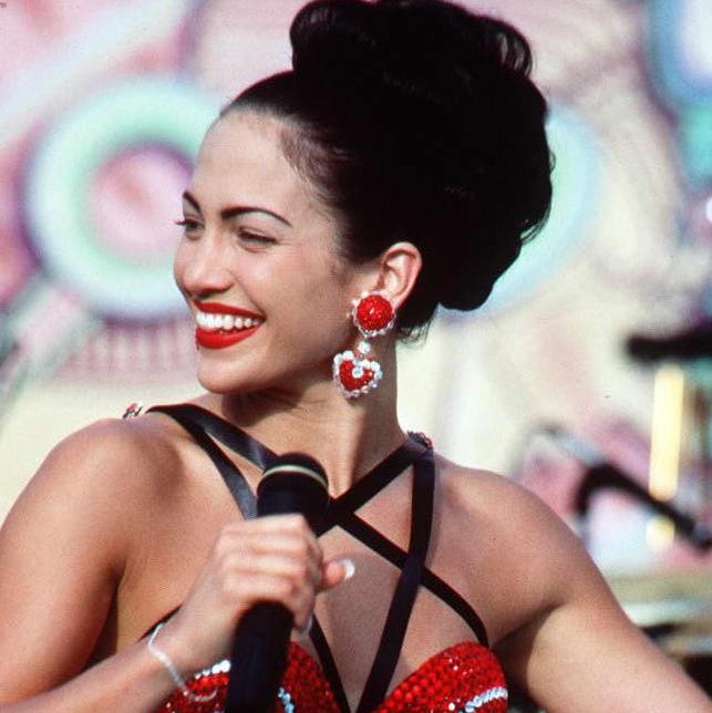 Actress Jennifer Lopez, who plays Selena in the mo hollywood, ca march 23: actress jennifer lopez, who plays selena in the movie selena, performs in one of the scenes from the movie. selena is about the tejano singer who is murdered by her fan club president. (photo credit should read scott del amo/afp via getty images)