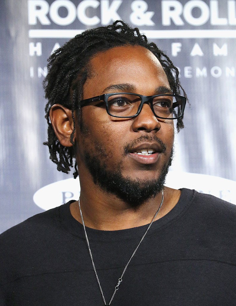 Hair, Eyewear, Hairstyle, Facial hair, Forehead, Glasses, Beard, Dreadlocks, Black hair, 