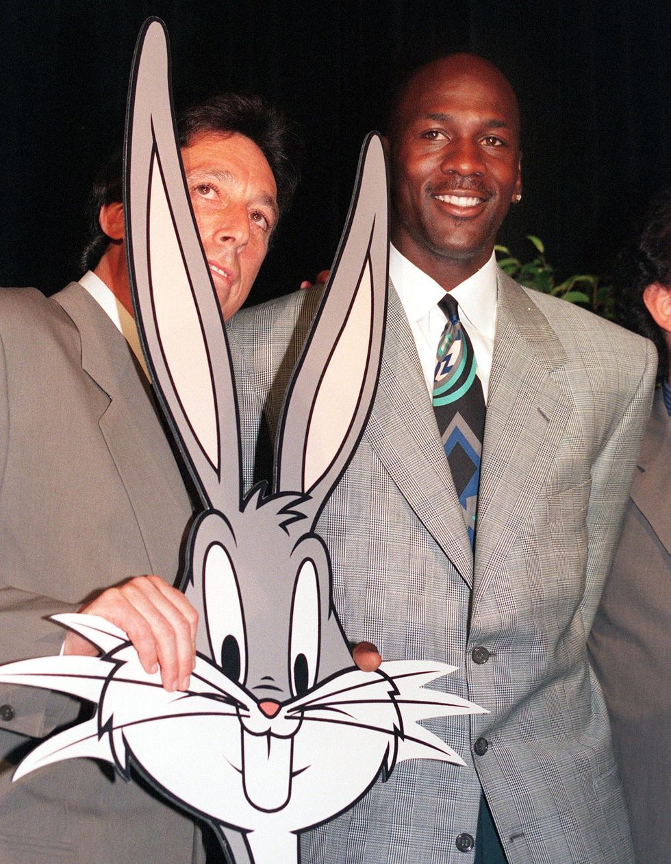 new york, ny   june 20  american basketball star michael jordan r poses with filmmaker ivan reitman l and a cutout of bugs bunny 20 june 1995 as they announce jordans film debut in an original live actionanimation comedy space jam  photo credit should read mark philipsafp via getty images