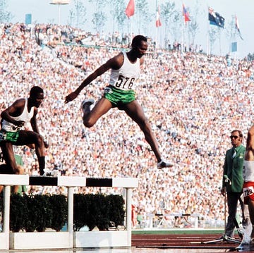 OLY-1972-ATHLETICS kipchoge keino (c) chases bronislaw malinowski (r) in the mens 3000m steeplechase final at the athletics event during the munich 1972 olympic games on september 5, 1972, in munich. keino won gold and also took a silver medal in the 1500 meter race. first kenyan runner, keino is known for his high altitude training, which helped introduced a technique to improve running time at any altitude. keinos most acclaimed victory came at the 1968 olympics, where, after having to jog a mile to the stadium because his taxi was stuck in traffic, he set an olympic record and won the 1500 meter race. / afp / (photo credit should read /afp via getty images)
