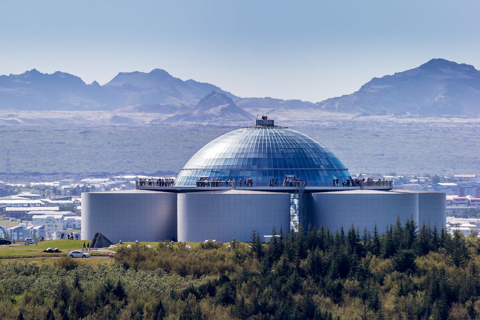 the pearl perlan is built on the top of huge tanks in which natural hot water is stored for heating reykjavik restaurants, meeting halls and a museum are housed in the dome
