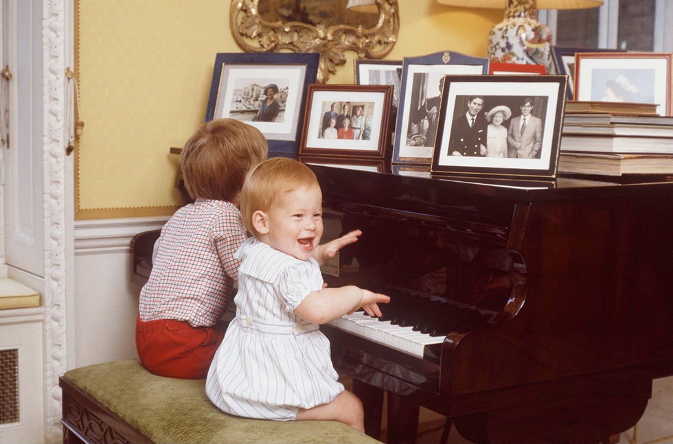 prince harry playing the piano at home at kensington palace