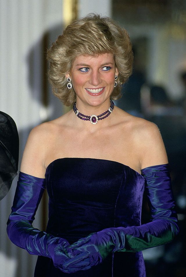 munich, germany   november 04  diana, princess of wales, wearing a purple velvet sleeveless evening dress designed by catherine walker with matching choker and earrings for a performance of mozarts opera marriage of figaro  at the munich opera house during her official visit to germany  photo by tim graham photo library via getty images