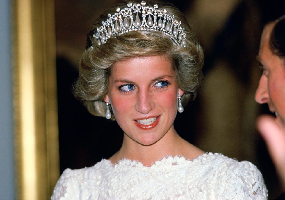 washington, united states november 11: diana, princess of wales, talking to her husband, during a visit to the british embassy. the princess is wearing a taffeta and lace gown with a scalloped neckline designed by murray arbeid with queen marys diamond and pearl tiara, a present from the queen. (photo by tim graham photo library via getty images)