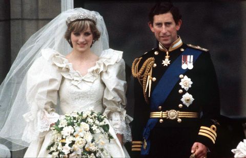 london, united kingdom   july 29  prince charles and princess diana on the balcony of buckingham palace on their wedding day  the princess is wearing a wedding dress designed by david and elizabeth emanuel  the prince is wearing naval dress uniform  photo by tim graham photo library via getty images