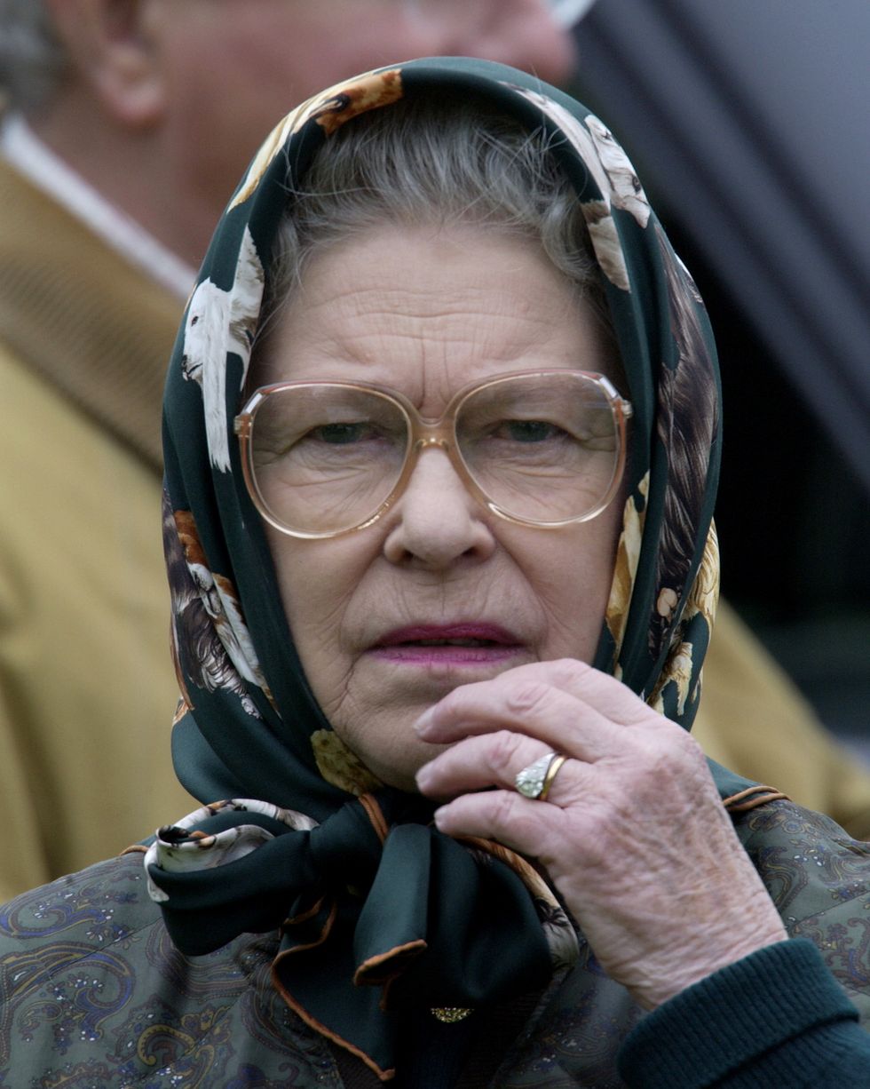 windsor, united kingdom   may 18  queen elizabeth ll in casual clothes, headscarf and spectacles, looking anxious while watching her husband competing  in the cross country section of the international carriage driving grand prix championships at the royal windsor horse show  photo by tim graham photo library via getty images