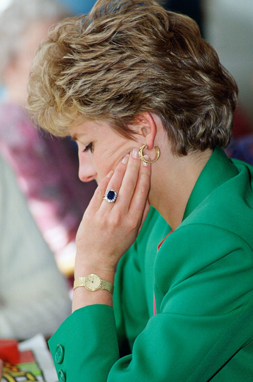 diana, princess of wales, wearing her diamond and sapphire engagement ring bought from garrards, the crown jewellers with a gold watch and gold earrings  photo by tim graham photo library via getty images