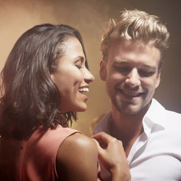 happy multi ethnic young couple enjoying at nightclub