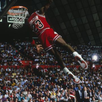 undated chicago bulls forward michael jordan 23 dunks as the crowd takes photos during a game against the portland trail blazers circa 1984 1998 photo by focus on sport via getty images