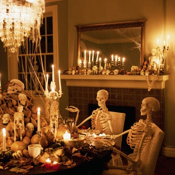 skeletons sits at a dining room table during a halloween party at the home of william joyce, well known childrens writer and illustrator