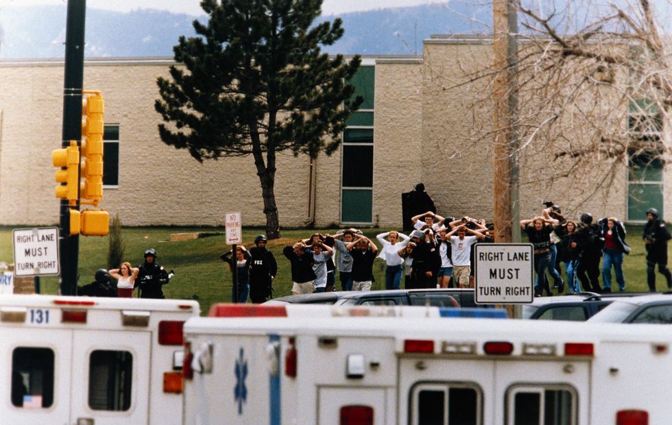 Columbine High School Students Exiting with Police After Shootings