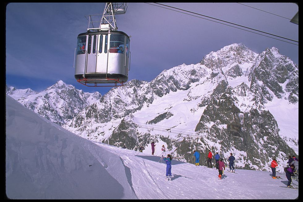 Skiers Ride Mountain Tramways on the Slopes Courmayeur, Italy