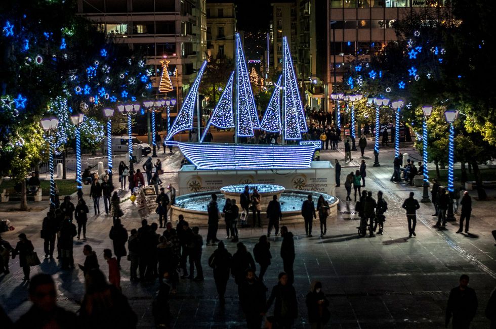 Syntagma Square features a ship decorated with lights at Christmas time in Athens Greece