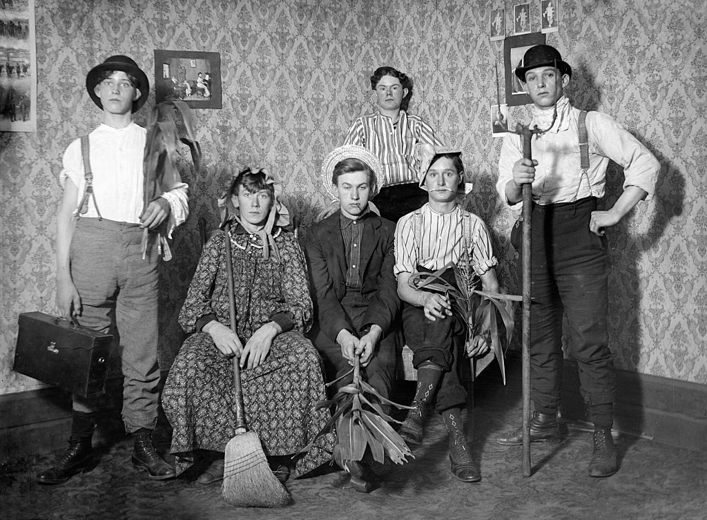 Teenage boys all dressed up in costumes, ca. 1905.