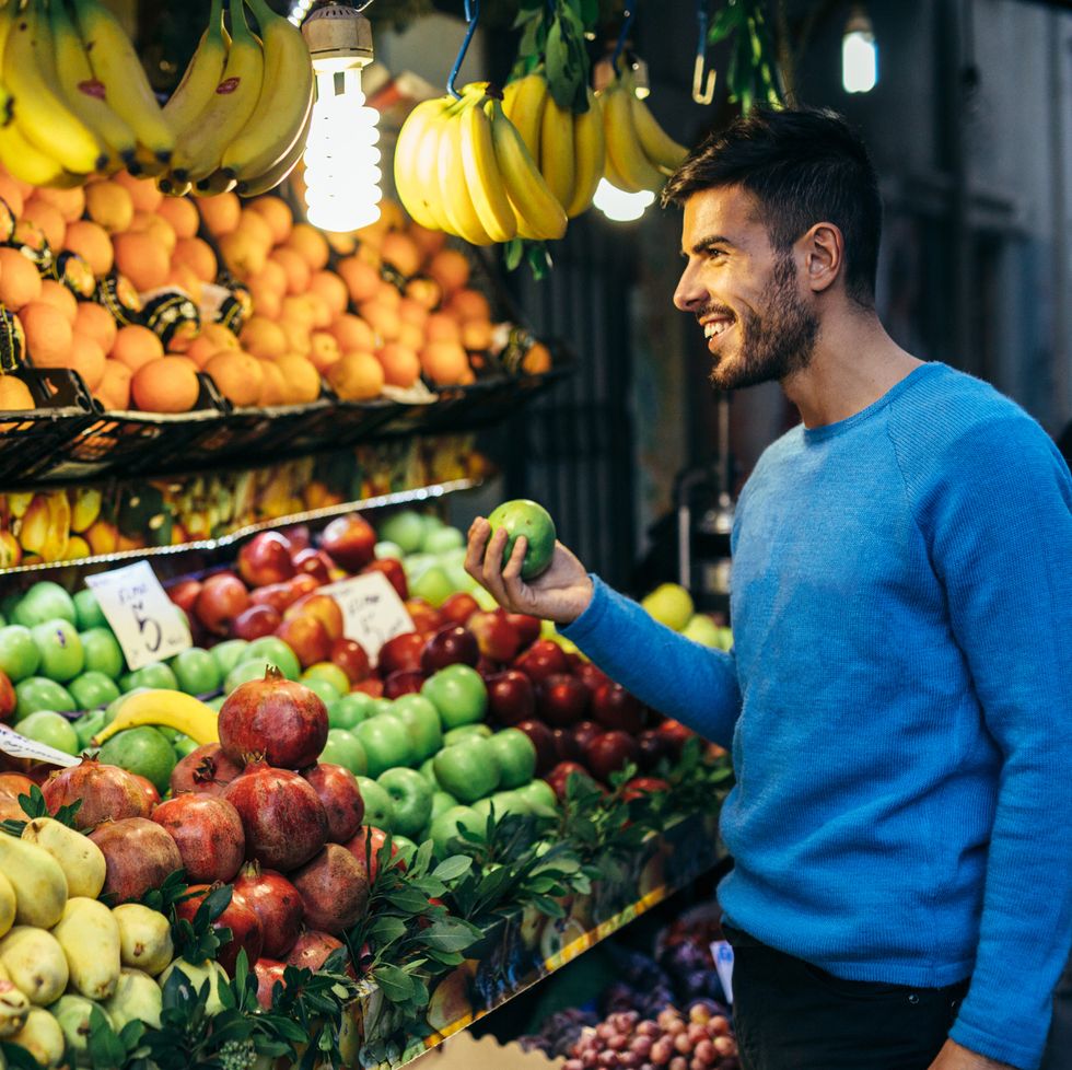 a man shopping some fruits