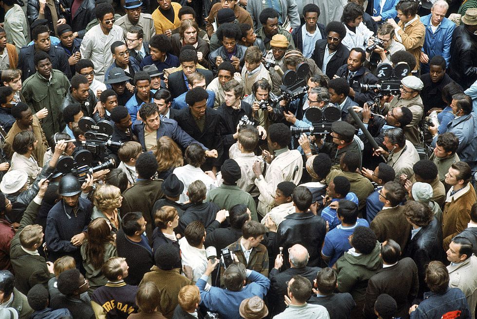 aerial view shows a large number of journalists with television cameras as they encircle a small group of black panthers, yippies and two american nazis outside of the courtroom during the trial of the chicago 7 for conspiracy to inicte a riot during the democratic national convention, chicago, illinois, september 1969 photo by lee baltermanthe life picture collection via getty images