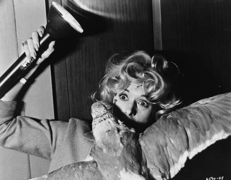 melanie daniels tippi hedren fights off an attacking gull in alfred hitchcock's the birds photo by �� john springer collectioncorbiscorbis via getty images