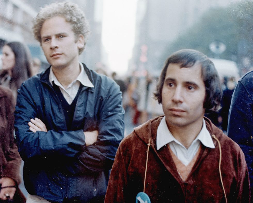 Art Garfunkel (L) and Paul Simon during the filming of a television special called "Songs of America," which aired on November 30, 1969