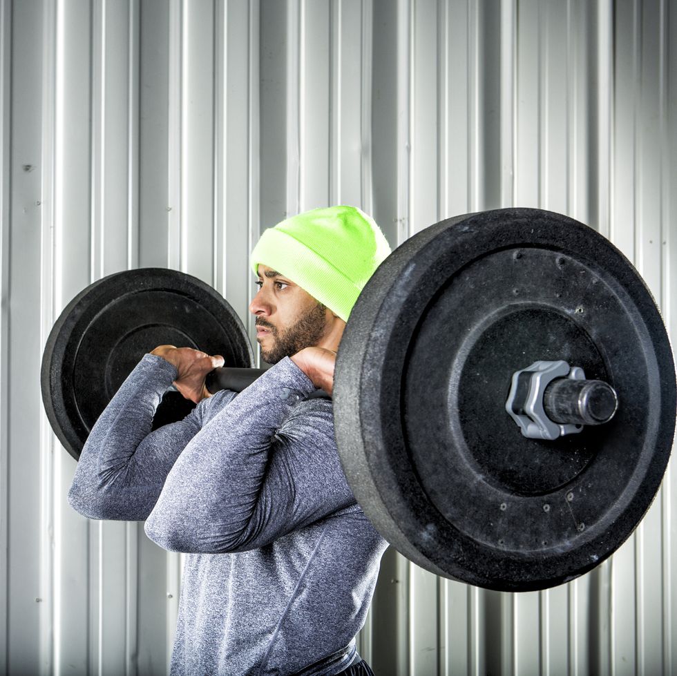 man lifting weights