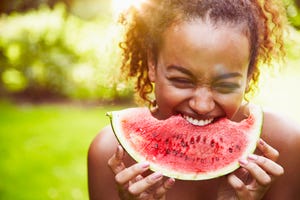 a boy eating a watermelon