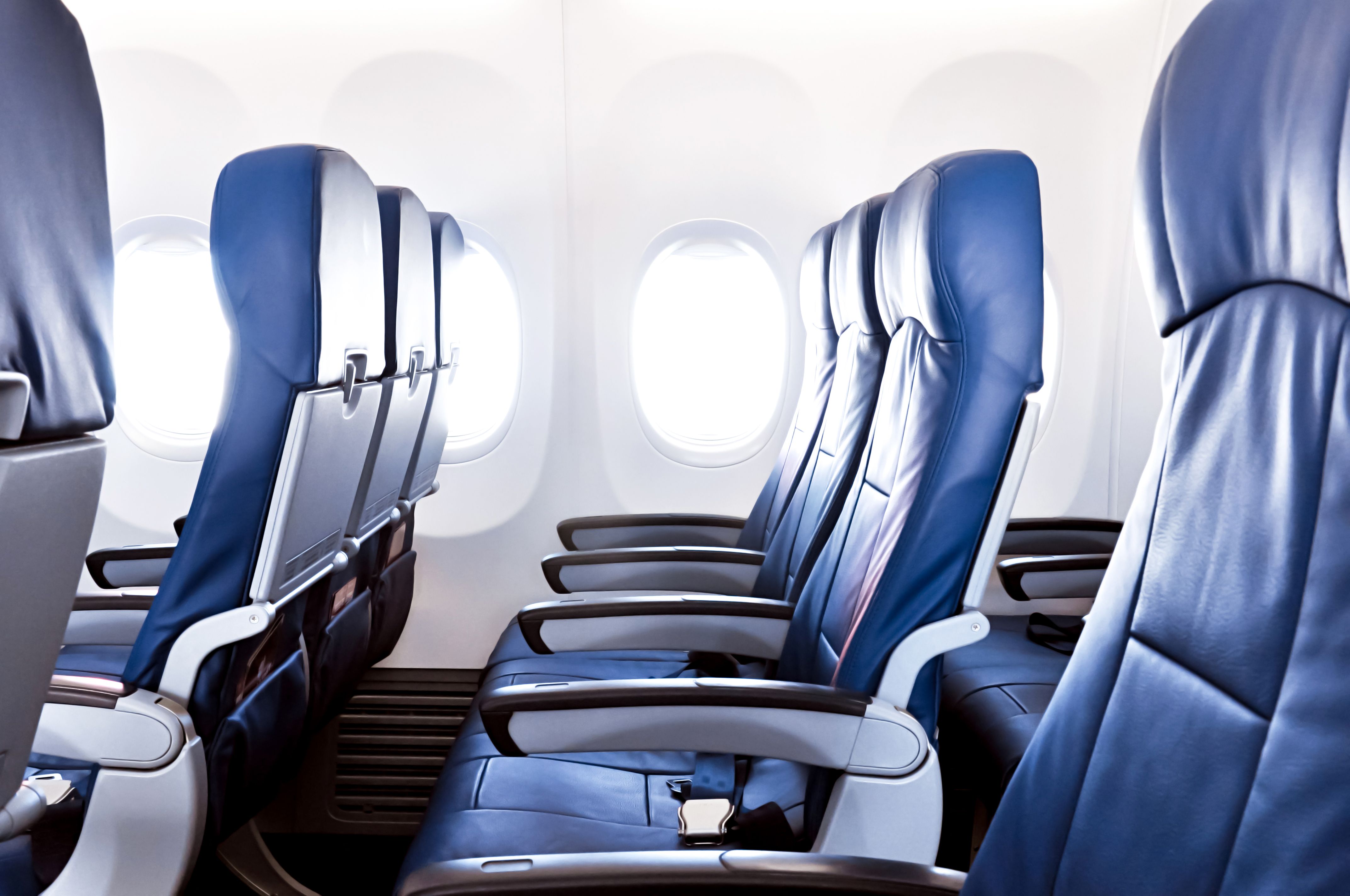 Blue, Airline, Head restraint, Massage chair, Air travel, Automotive design, Office chair, Vehicle, Chair, Room, 