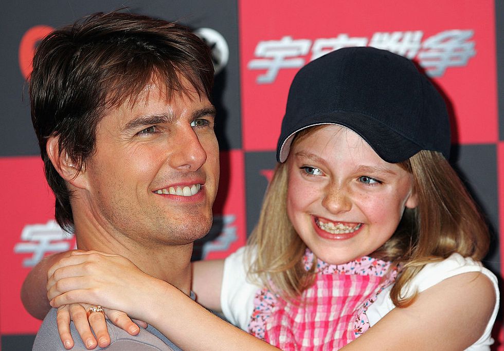 tokyo, japan june 13 actor tom cruise and actress dakota fanning attend a photo call to promote war of the worlds on june 13, 2005 in tokyo, japan the film will open on june 29 simultaneously worldwide photo by koichi kamoshidagetty images 