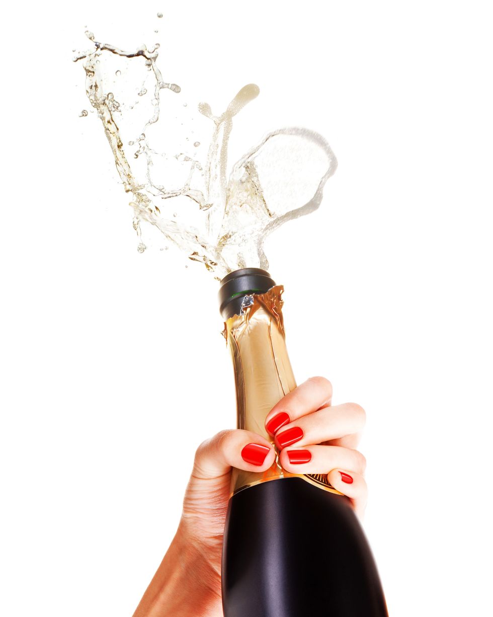Perfect red manicure with champagne bottle