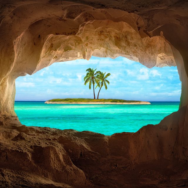 an old indian cave located on a remoteturks and caicos island beautiful caribbean sea glowing and warm sunlight bathing some remote palm trees on a deserted island