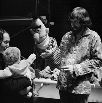 new york 1970 puppeteer jim henson holding bert, amuses a baby during rehearsal for an episode of sesame street at reeves teletape studio in 1970 in new york city, new york photo by david attiegetty images 