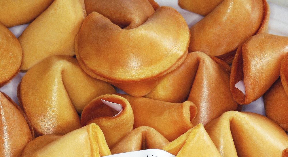 Fortune cookies with one displaying fortune