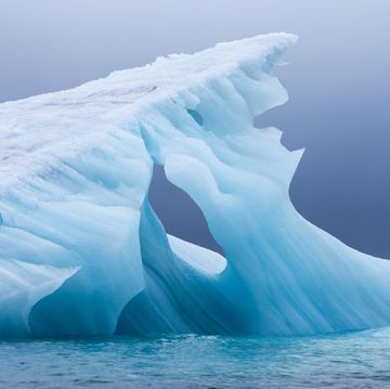 norway, svalbard, spitsbergen island, melted blue surface of glacial iceberg near hinlopen strait photograph by paul souders