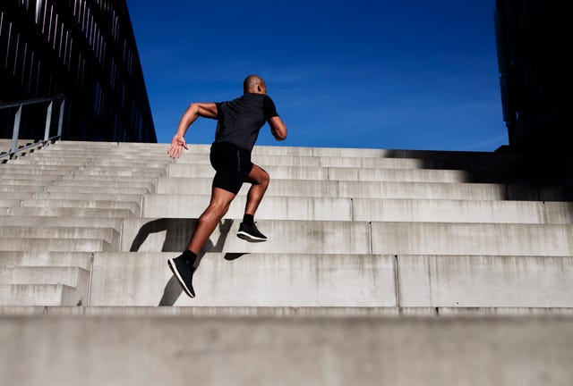 man running up outdoor stairs