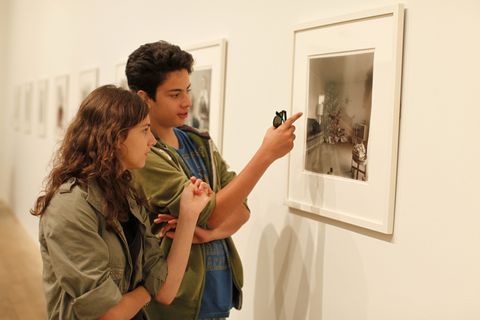 Teenagers looking at a picture at the Tate Modern