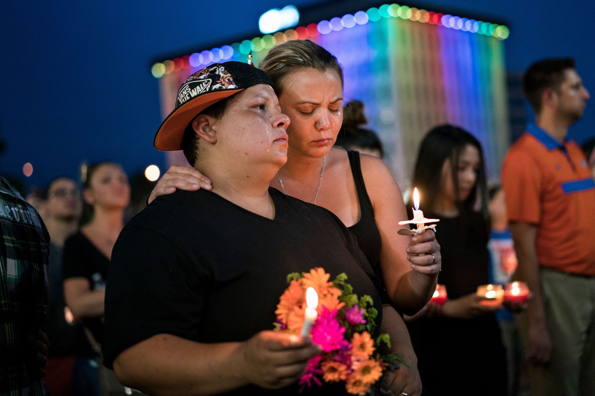 topshot nicole edwards and her wife kellie edwards observe a moment of silence during a vigil outside the dr phillips center for the performing arts for the mass shooting victims at the pulse nightclub june 13, 2016 in orlando, florida the american gunman who launched a murderous assault on a gay nightclub in orlando was radicalized by islamist propaganda, officials said monday, as they grappled with the worst terror attack on us soil since 911 photo by brendan smialowski afp photo by brendan smialowskiafp via getty images