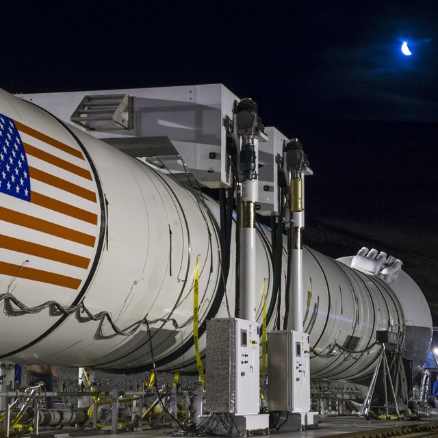 In this handout provided by NASA, the moon rises ahead of the second and final qualification motor (QM-2) test for the Space Launch System's booster on Tuesday, June 28, 2016, at Orbital ATK Propulsion Systems test facilities in Promontory, Utah. 