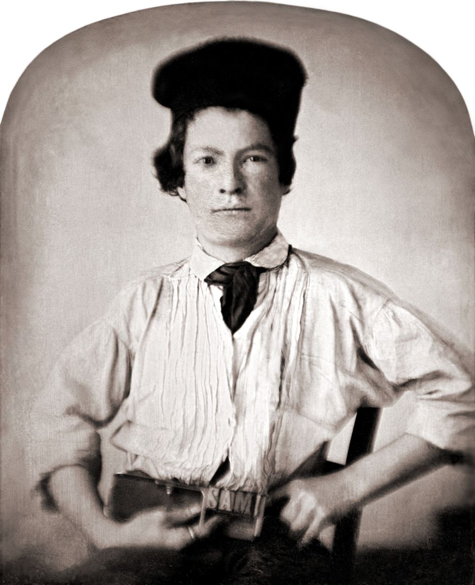 portrait of mark twain at 15, holding a printer's composing stick with letters sam
