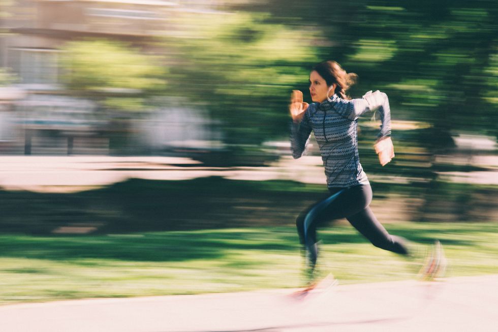 a woman running outside in the city