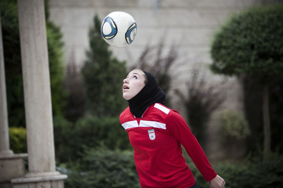 Red, Volleyball, Ball, Volleyball, Soccer ball, Grass, Football, Player, Photography, Leisure, 