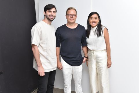 designers patrick doss, matt breen, and andrea tsao of deveaux wearing minimalist black and white outfits and standing side by side