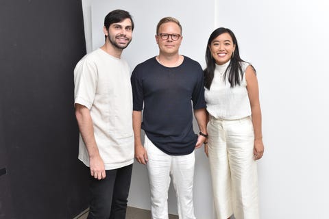 Designers Patrick Doss, Matt Breen, and Andrea Tsao of Deveaux designers patrick doss, matt breen, and andrea tsao of deveaux wearing minimalist black and white outfits and standing side by side