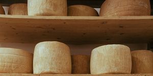 earthenware, Dairy, Gruyère cheese, Pottery, Wood, Cheese, Cheesemaking, Parmigiano-reggiano, Tableware, Bowl, 