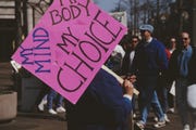 a pro choice march in washington, dc, 4th may 1992 one protestor carries a placard which reads 'my mind, my body, my choice' photo by alfred gescheidtgetty images