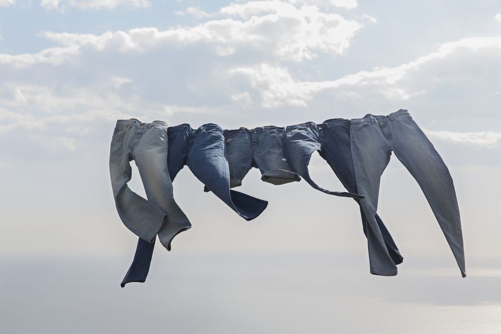 jeans hanging on a clothesline in the wind
