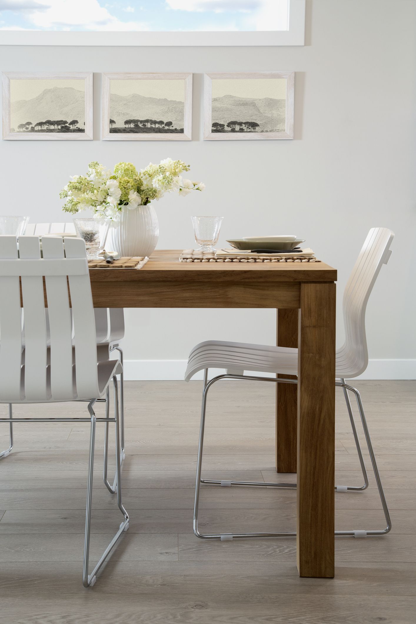 White chairs at wooden dining table