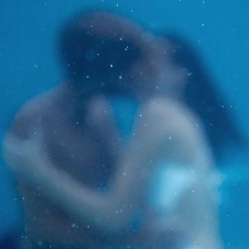 soft focus photo of young couple kissing, embracing under water, underwater love, together forever, falling in love