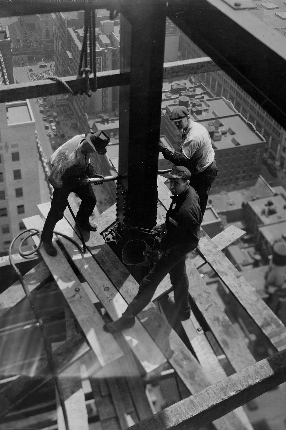construction workers build the frame of the bank of manhattan trust company building at 40 wall street later known as the trump building, new york, new york, 1930 the three men form a team for riveting the man at left is the riveter who fires the rivet, the man opposite him is the bucker who pushes against the end of the rivet, and the third man is the heater who loads the rivet gun, called a cricket photo by arthur gerlachthe life picture collection via getty images