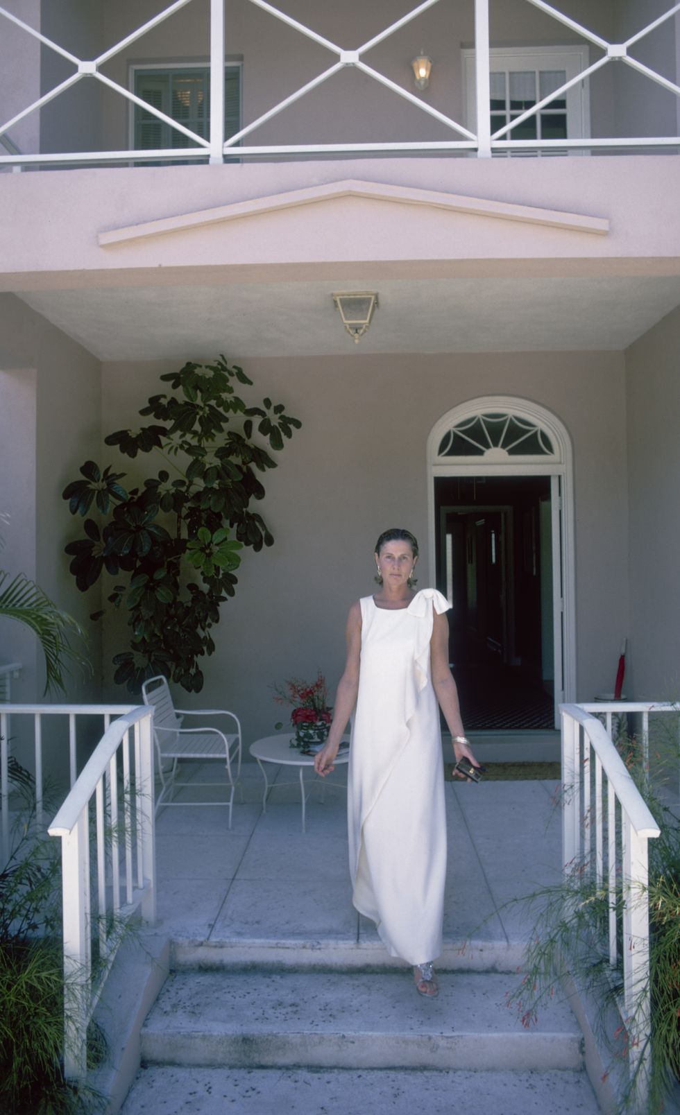 american socialite nancy slim keith, lady keith 1917 1990 steps onto her porch in lyford cay, new providence island, april 1974 photo by slim aaronshulton archivegetty images