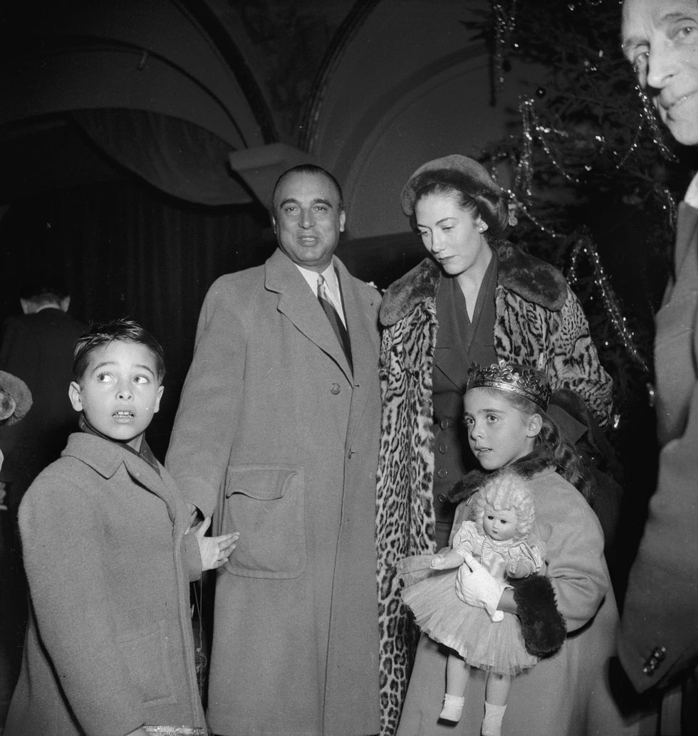 france   circa 1951  marcel rochas 1902 1955, french top designer and his wife helene wholl take his succession paris, christmas party rochas, january 1951  photo by roger viollet via getty imagesroger viollet via getty images
